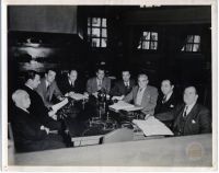 Members of the Counsel for the Defense in the Courtroom