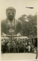 Photograph of a Group in front of a Statue of Buddha