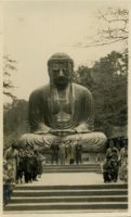 Photograph of Buddha Statue and People