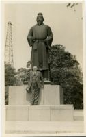 Photograph of Man and Statue